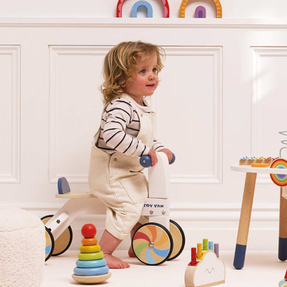 Tęczowy pierwszy jeździk, drewniana zabawka na kołach dla dzieci Le Toy Van